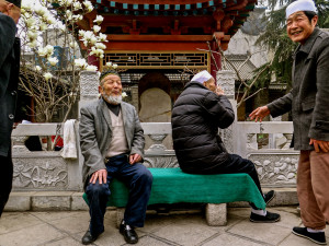Old Hui Muslim men at a Mosque in Xian. The gentleman turning his back was embarrassed about his bad teeth.